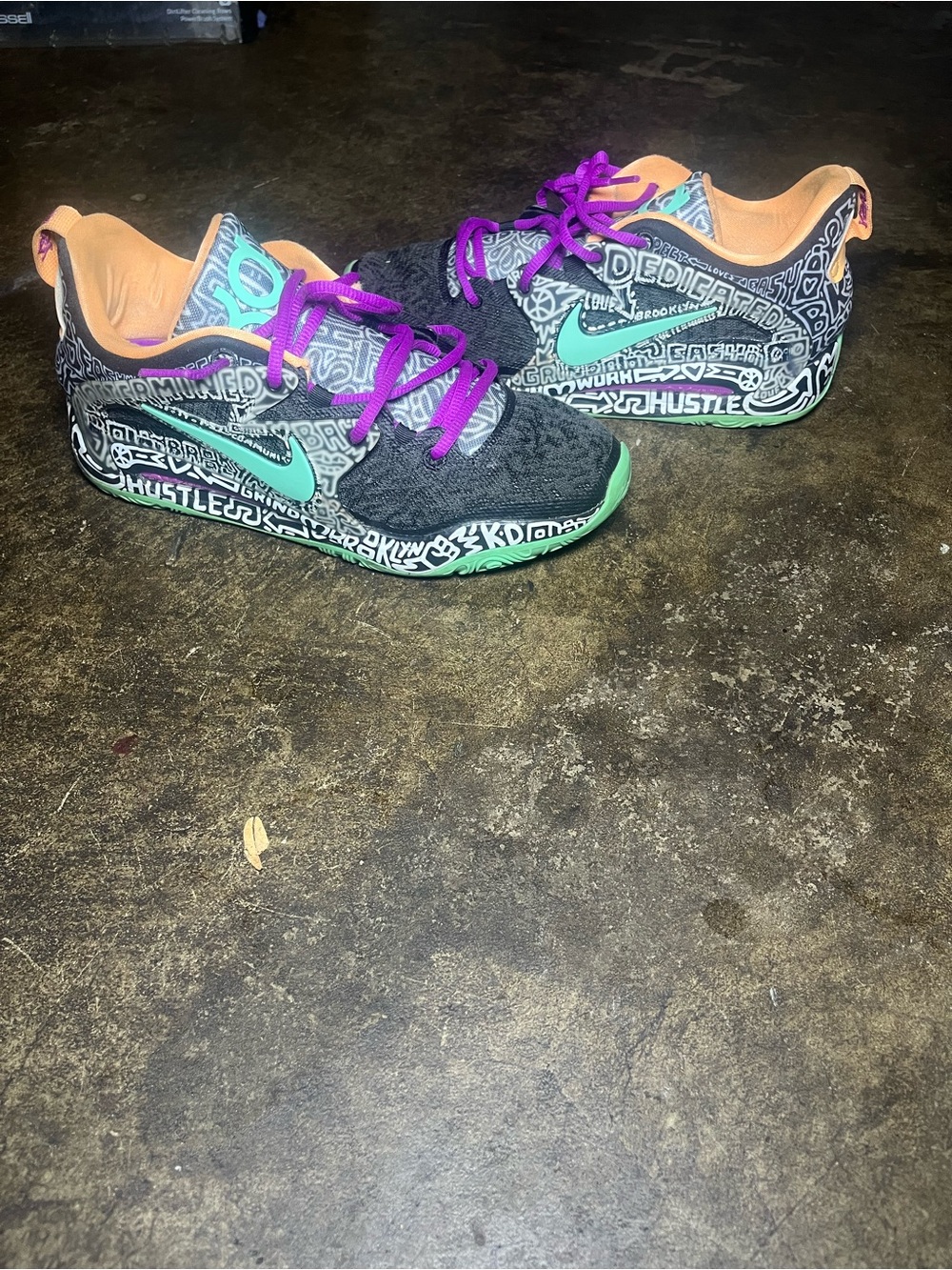 Nike Kids Black Sneakers with Teal Swoosh and Purple Laces